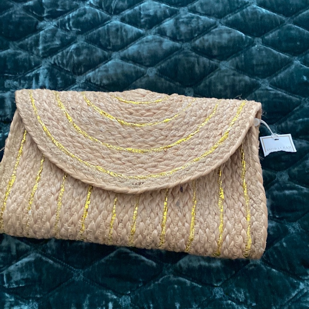 Pretty jute clutch.  Tan with gold stripes/stitching.
